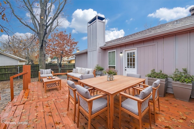 wooden deck with outdoor lounge area