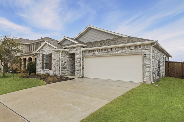 view of front of house with a garage and a front lawn