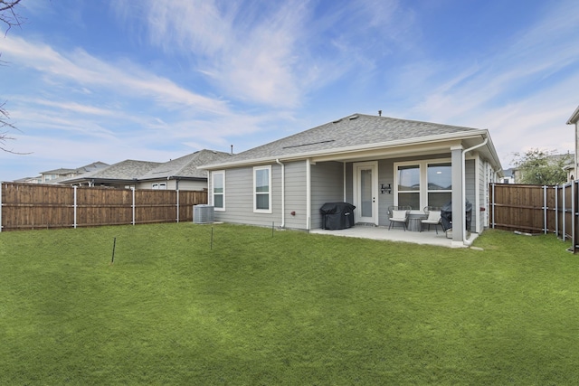 back of property featuring central AC, a patio, and a lawn