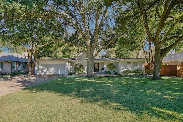 view of front facade with a garage and a front yard