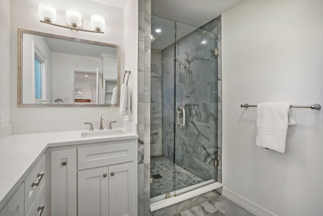 bathroom featuring vanity and a shower with door