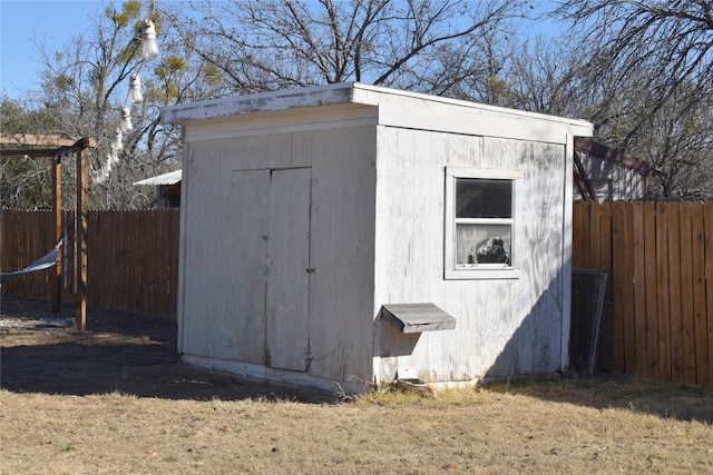 view of outbuilding with a lawn