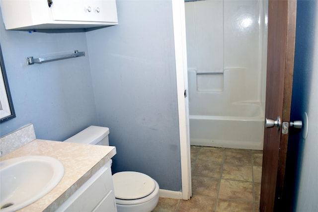 bathroom featuring vanity, tile patterned floors, and toilet