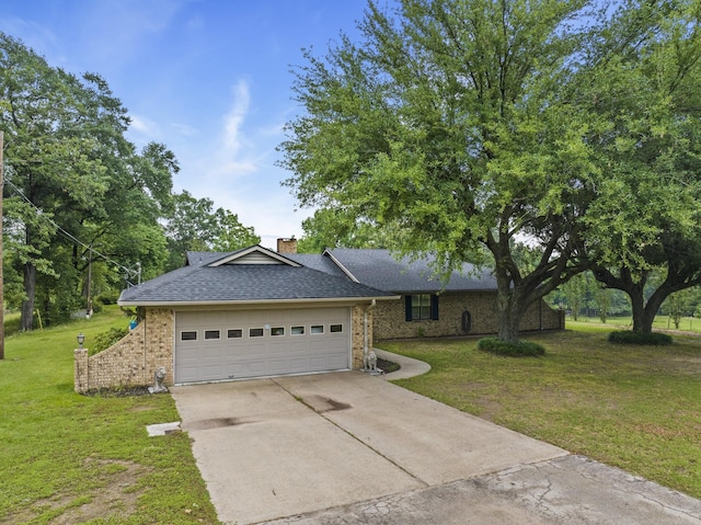 ranch-style house featuring a garage and a front lawn