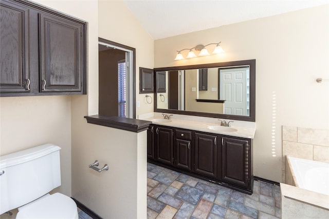 full bathroom with lofted ceiling, toilet, a bath, and a sink