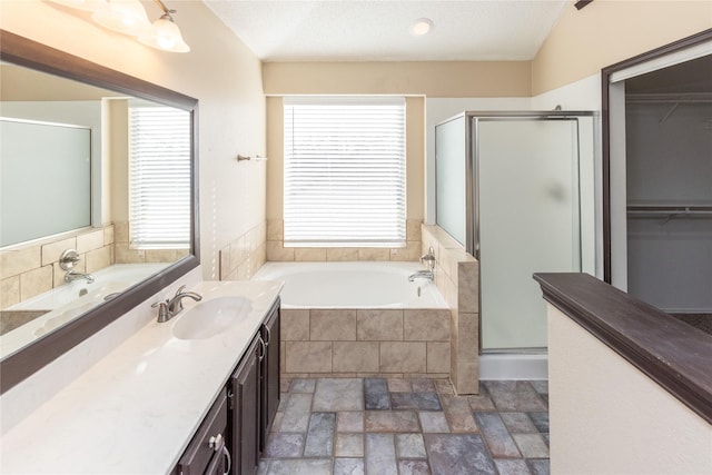 full bath with a shower stall, a healthy amount of sunlight, and a garden tub