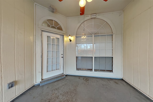 view of exterior entry with ceiling fan