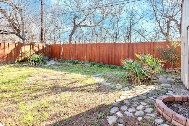 view of yard featuring a fenced backyard