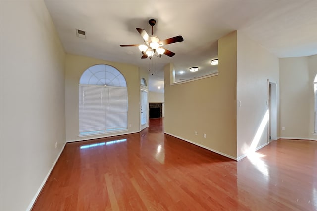 unfurnished room featuring hardwood / wood-style flooring and ceiling fan