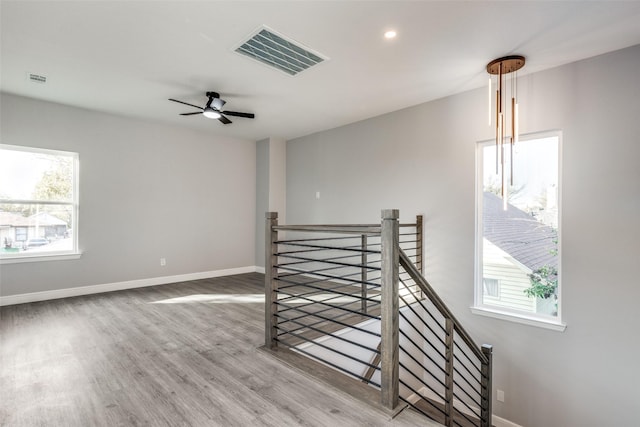 spare room featuring hardwood / wood-style flooring and ceiling fan