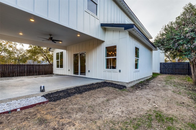 view of property exterior featuring ceiling fan and a patio area