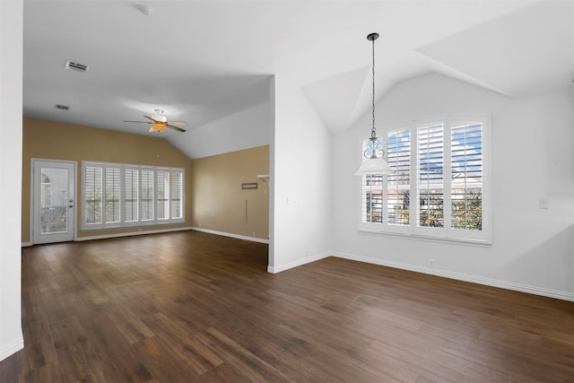 unfurnished living room featuring vaulted ceiling, dark hardwood / wood-style floors, and ceiling fan