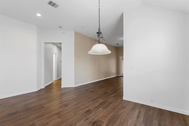 unfurnished room with vaulted ceiling and dark hardwood / wood-style floors