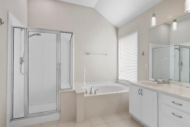 bathroom featuring separate shower and tub, vanity, tile patterned flooring, and vaulted ceiling