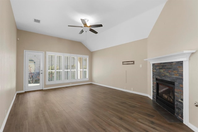 unfurnished living room featuring dark hardwood / wood-style flooring, a fireplace, ceiling fan, and vaulted ceiling