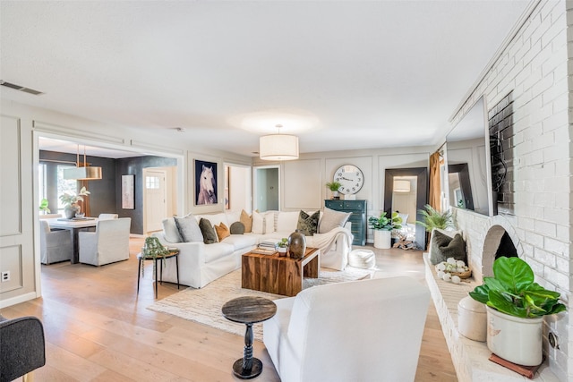 living room with light hardwood / wood-style flooring