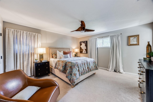 bedroom with light carpet and ceiling fan