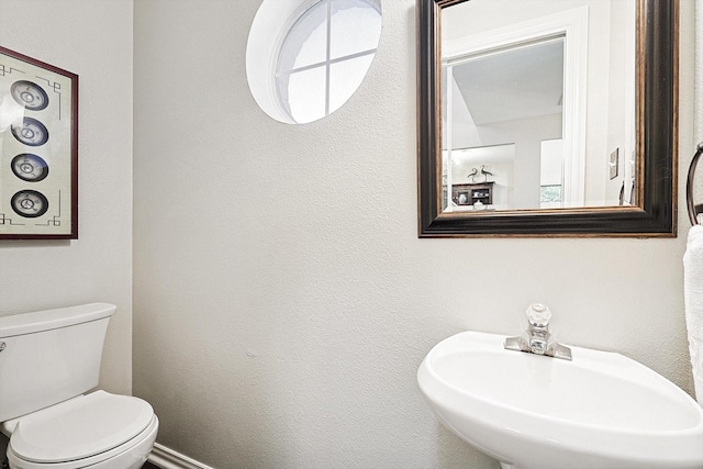 bathroom with sink and toilet