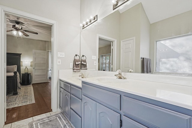 bathroom with vanity, tile patterned floors, ceiling fan, and lofted ceiling