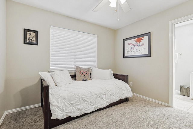 carpeted bedroom featuring connected bathroom and ceiling fan