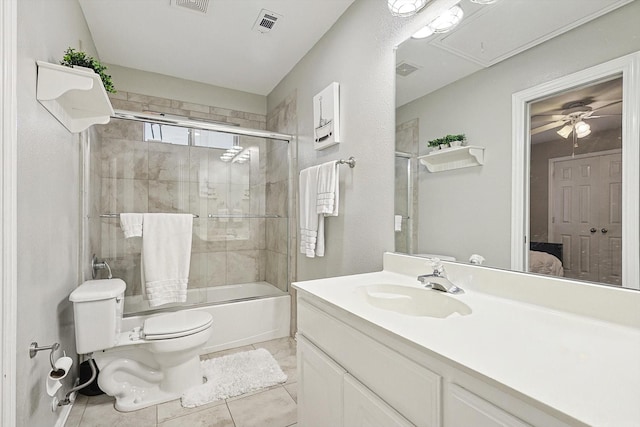 full bathroom featuring tile patterned flooring, vanity, shower / bath combination with glass door, and toilet