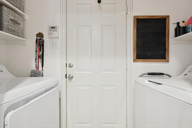 laundry area with washing machine and clothes dryer