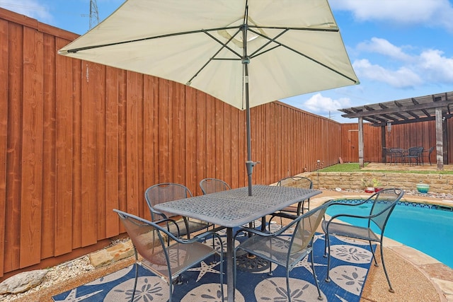 view of patio / terrace featuring a fenced in pool and a pergola