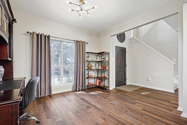 unfurnished office with dark hardwood / wood-style floors and a chandelier