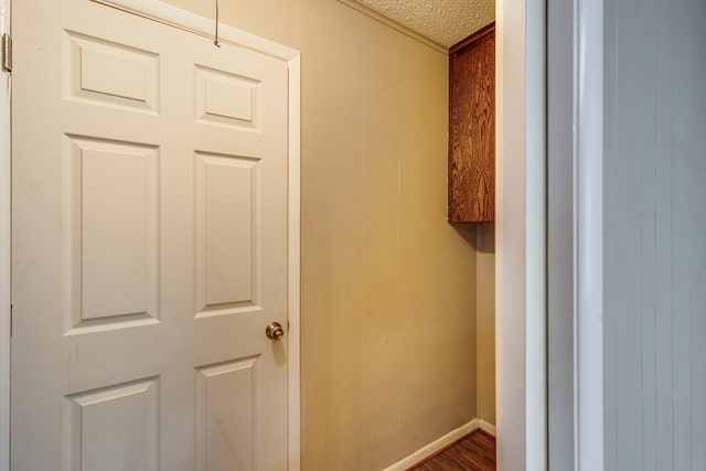 interior space with hardwood / wood-style floors and a textured ceiling