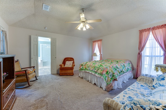 bedroom with multiple windows, light colored carpet, a textured ceiling, and ceiling fan