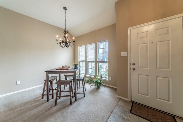 dining area with a chandelier, vaulted ceiling, baseboards, and carpet floors