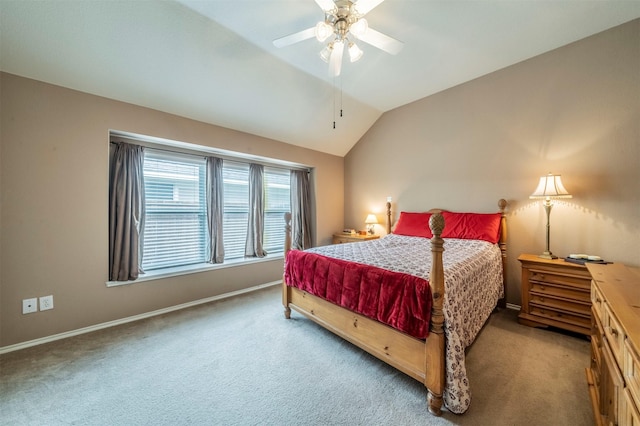 bedroom featuring a ceiling fan, lofted ceiling, carpet, and baseboards