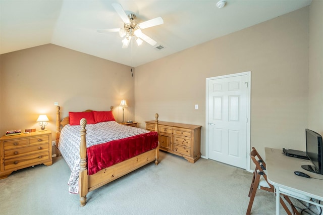 bedroom with visible vents, lofted ceiling, light colored carpet, and a ceiling fan