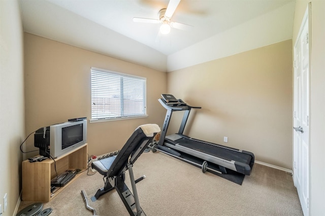 exercise room with baseboards, a ceiling fan, lofted ceiling, and carpet