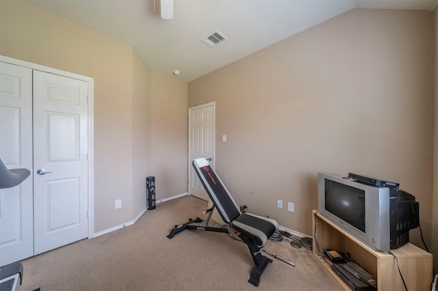 workout area featuring lofted ceiling, carpet flooring, baseboards, and visible vents