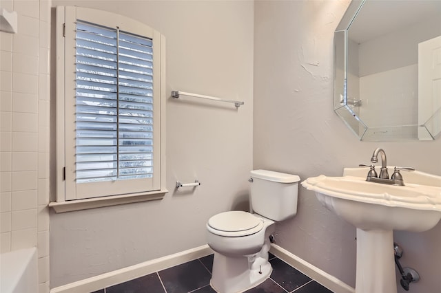 bathroom featuring tile patterned floors and toilet