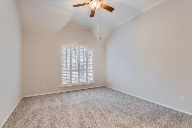 carpeted spare room featuring lofted ceiling and ceiling fan