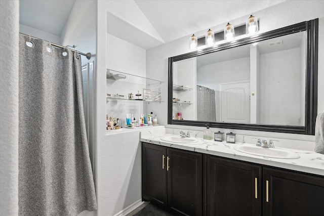 bathroom featuring vanity and a shower with curtain