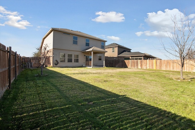 back of property featuring a yard