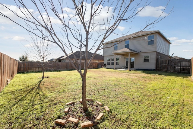 rear view of house with a lawn