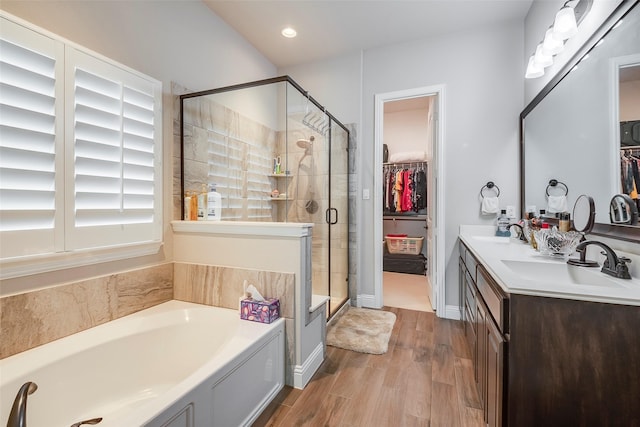 bathroom with vanity, hardwood / wood-style flooring, and independent shower and bath