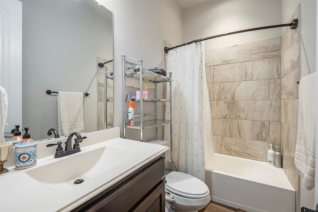 full bathroom with shower / tub combo with curtain, vanity, and toilet