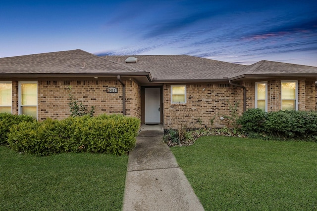 view of front of home with a lawn