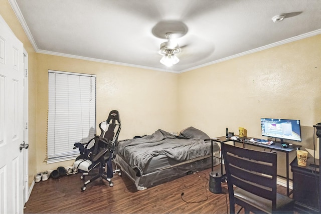 bedroom with hardwood / wood-style flooring and crown molding