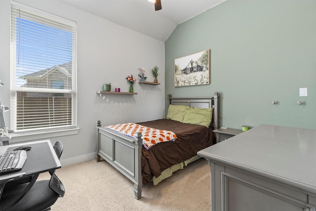 carpeted bedroom with ceiling fan and lofted ceiling