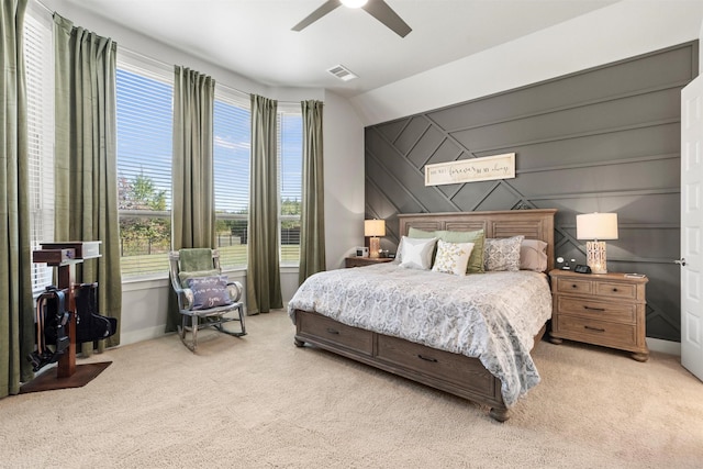 bedroom featuring light colored carpet and ceiling fan