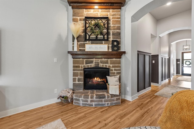 living room featuring hardwood / wood-style flooring and a fireplace