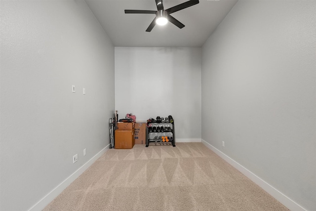 misc room featuring light carpet and ceiling fan