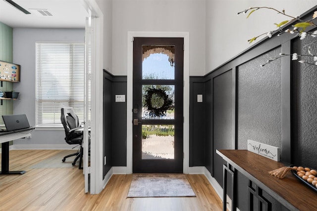 foyer with light hardwood / wood-style floors