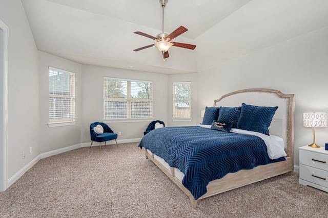 carpeted bedroom featuring ceiling fan and vaulted ceiling